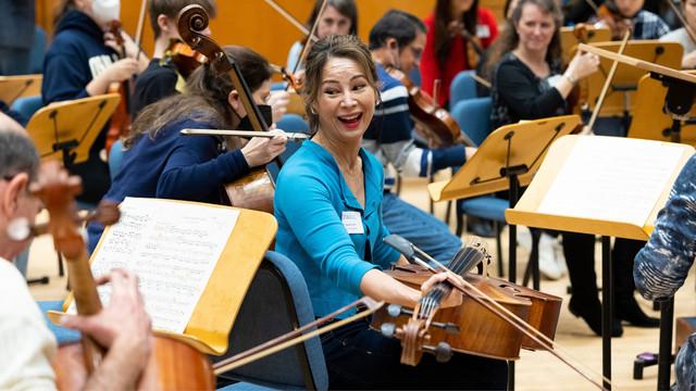 orchestra member sitting in rehersal